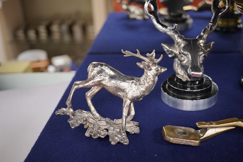 Five chrome and brass car radiator mascots; three in the form of stags’ heads, a stag standing on an oak branch and an Art Deco leading gazelle. Condition - fair, some losses to chrome plating.